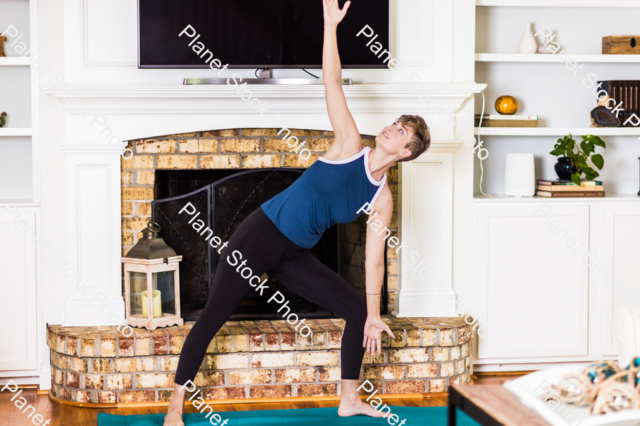 A young lady working out at home stock photo with image ID: 53d3eb16-2143-4003-9263-805e2db6f30f