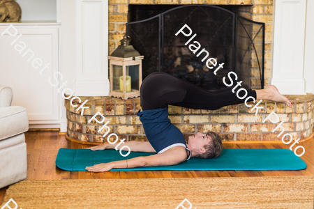 A young lady working out at home stock photo with image ID: 0029ed10-b582-477e-8e85-d12149bb06c7