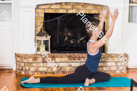 A young lady working out at home stock photo with image ID: 020d6c64-ba59-4e71-a899-d0b8b69b6a65