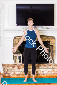 A young lady working out at home stock photo with image ID: 029f2a03-a528-4676-9037-9c14cae01b28