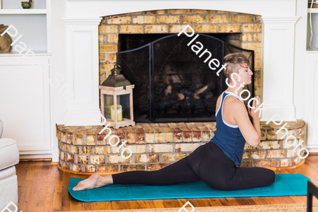 A young lady working out at home stock photo with image ID: 1221f453-fbaa-4d45-8a5b-731065781160