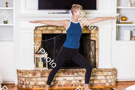 A young lady working out at home stock photo with image ID: 133f567a-8d7d-4ddf-b9af-33e3f880f822