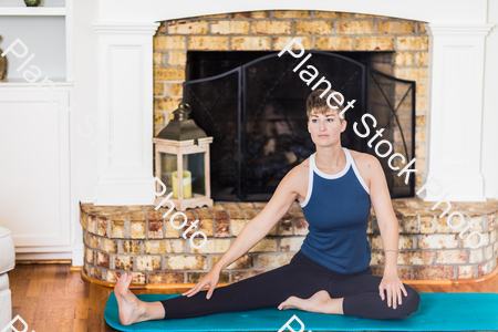 A young lady working out at home stock photo with image ID: 203891ea-8209-4b76-b9dc-8e8d529b37a1