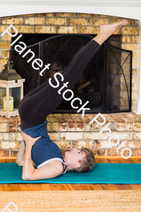 A young lady working out at home stock photo with image ID: 25bf77e5-5ccd-4ccd-8e8e-75225b31b847