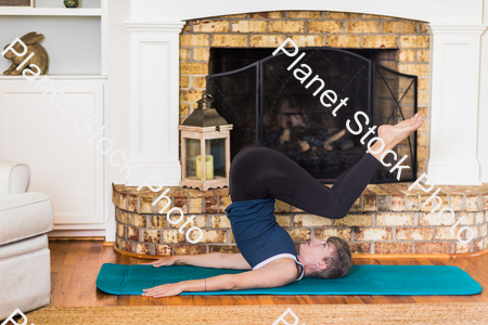 A young lady working out at home stock photo with image ID: 296b66bf-e72b-4d71-b011-3584d8f2d9a2