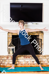 A young lady working out at home stock photo with image ID: 30802dc1-9690-46a8-b000-142db3866aa6