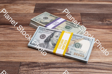 Three stacks of dollar bills stock photo with image ID: 32317607-f6be-4977-a68b-6ad93e06309f