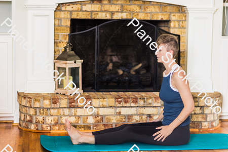 A young lady working out at home stock photo with image ID: 4482ab87-726b-4fef-9b59-249c9b2100d9