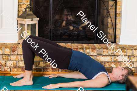 A young lady working out at home stock photo with image ID: 4d9fea5e-5873-485b-8261-d83aa1e24ad1