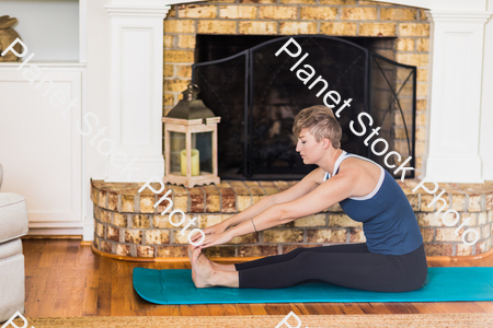 A young lady working out at home stock photo with image ID: 50ab700d-fdf4-48be-8036-240b00d35415