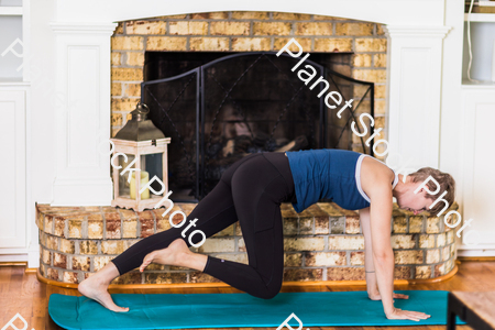 A young lady working out at home stock photo with image ID: 511dd737-8e46-4129-9957-86edd461cd13