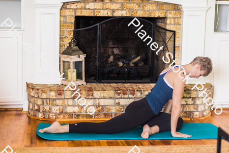 A young lady working out at home stock photo with image ID: 54031c6f-3e48-4c80-af57-6a56f35f84eb