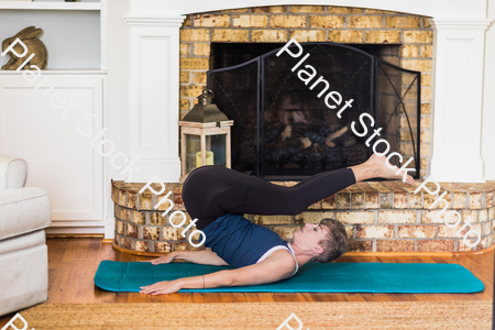 A young lady working out at home stock photo with image ID: 561db169-6dd4-459e-8800-bbf92cd4963e