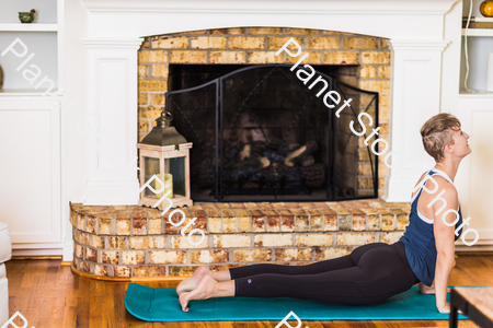 A young lady working out at home stock photo with image ID: 5aa77d26-f714-4aab-823e-21c6c4f7f978