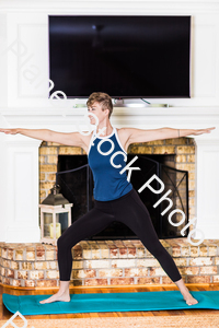 A young lady working out at home stock photo with image ID: 5b6bcc61-558d-4eca-bb0a-56540e0fc1f6