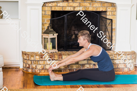 A young lady working out at home stock photo with image ID: 6a208593-b78f-40dd-9571-2a7336032609