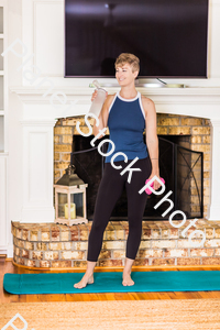 A young lady working out at home stock photo with image ID: 6c98222e-6dfb-4e09-9090-17b506bb0836