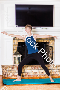 A young lady working out at home stock photo with image ID: 701039b1-70cc-440d-95aa-18ebd1ac8ffa