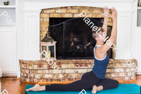 A young lady working out at home stock photo with image ID: 83673ff6-145c-43bf-8f8c-590b83eca9fd