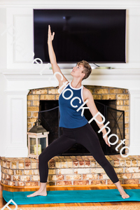 A young lady working out at home stock photo with image ID: 8fe1e911-88a2-4cdb-a7b3-494bf1fa41c0