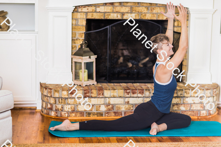 A young lady working out at home stock photo with image ID: 94c28009-3387-4ab6-943b-48e9356bd948