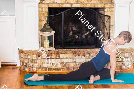 A young lady working out at home stock photo with image ID: 9c9de63f-4352-46df-97f3-0152a1f1e539