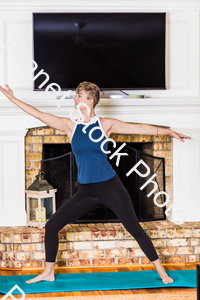 A young lady working out at home stock photo with image ID: 9cd6b8b1-c4d3-42e8-a57a-5b9f24d600ff