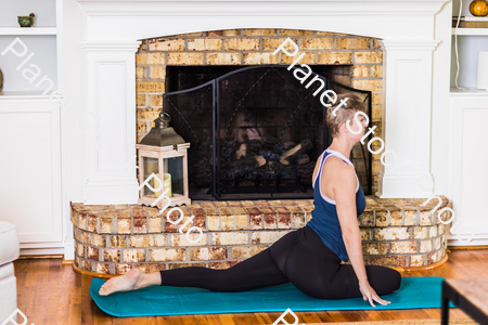 A young lady working out at home stock photo with image ID: adc00c6b-2f3f-4d0b-89b7-1334379a4802