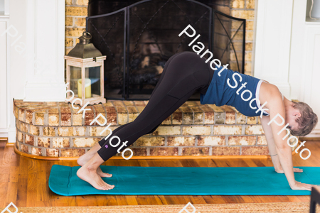 A young lady working out at home stock photo with image ID: c17d7139-67b8-46b6-9a13-58789c70de95