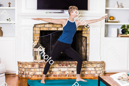 A young lady working out at home stock photo with image ID: c20e822c-dfe1-482f-890f-21a109d106b7