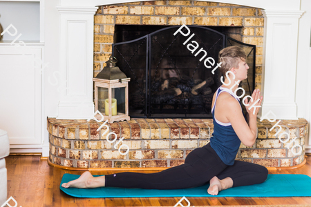 A young lady working out at home stock photo with image ID: c4f58769-be34-4926-9273-c583a3d093c9