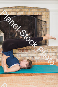 A young lady working out at home stock photo with image ID: c8508948-f77e-43a4-bc3c-d00ea64d991a