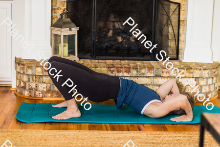 A young lady working out at home stock photo with image ID: cac21e57-ca31-4162-98af-2ef85819acef