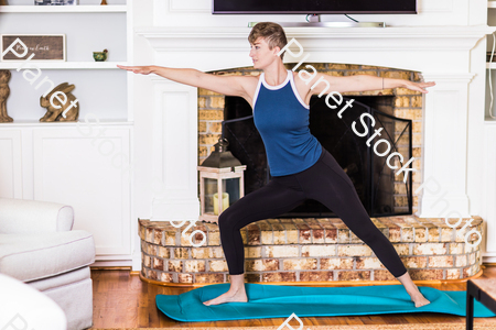 A young lady working out at home stock photo with image ID: d6b2f41d-5b34-4cdc-a384-bd0d7cb6d047