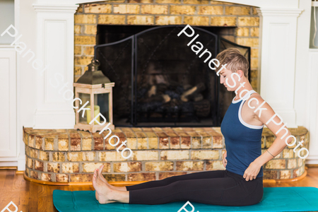 A young lady working out at home stock photo with image ID: d78ebeb3-a66c-4b6f-8dae-172942c1e7a4