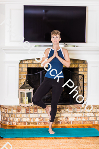 A young lady working out at home stock photo with image ID: d7c8f3be-34fe-4008-b751-4a57396f21dc