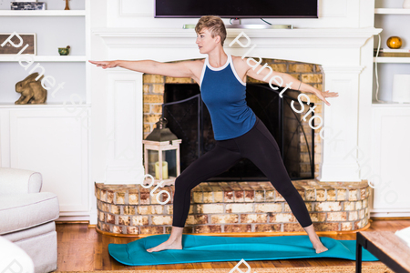 A young lady working out at home stock photo with image ID: df88f5fe-5d51-42dc-a1a5-39b86080b827