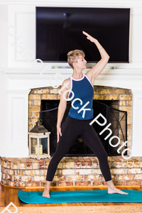 A young lady working out at home stock photo with image ID: e2b03958-e26b-4261-80ed-ec9428b393e9