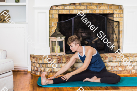 A young lady working out at home stock photo with image ID: e75ae924-7d3b-446e-aeb5-bd5ea4d9366b