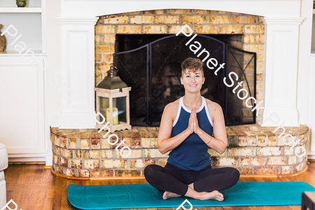 A young lady working out at home stock photo with image ID: e859000b-6c53-4f83-8cbe-0031a218bb31