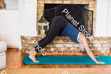 A young lady working out at home stock photo with image ID: ea1750df-aa73-48ef-b4a7-7f677cd40c8f