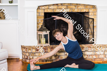 A young lady working out at home stock photo with image ID: eef36dca-1994-4a47-8f65-8ae56a93e46b