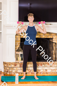 A young lady working out at home stock photo with image ID: f1882fb6-d763-4d28-88a0-04a7faaeffa6