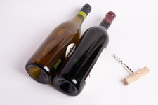 Two bottles of wine, with corkscrew